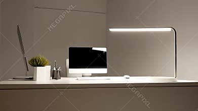 Minimalist office desk with computer, gray and white, modern workspace and home office setup with copy space