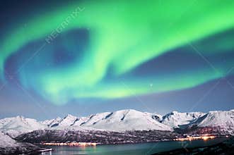 Northern lights above fjords in Norway