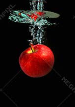 Apple falling into water