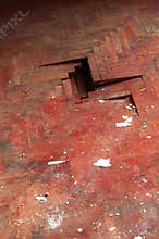 Wooden parquet floor red detail defect