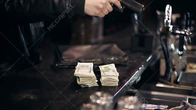 Successful bar robbery. The robber breaks into a bar and takes the money
