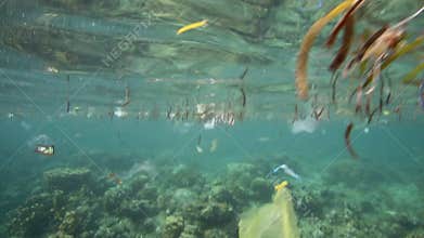 Plastic bags and other garbage floating underwater