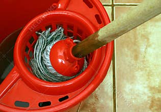 cleaning with mop and bucket