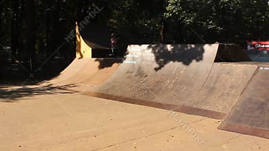 Teens practicing skateboard