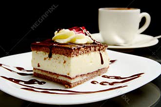 Food of sweet creamy chocolate cake with coffee.