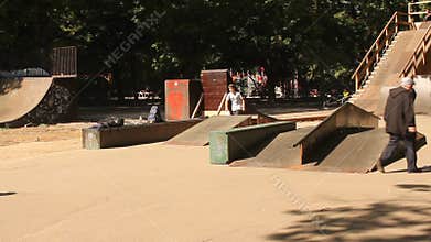 Teens practicing skateboard