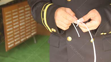 Navy officer making knots
