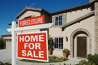 Foreclosure Home For Sale Sign in Front of House