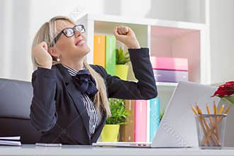 Young business woman enjoying success at work