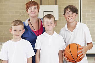 Teacher With Boys School Basketball Team