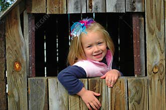Child in wooden house