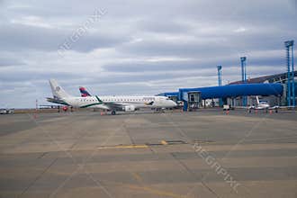 Latam Airlines Airbus A321 and Amelia Embraer E190LR in Silversea Expeditions livery at the terminal gates in Punta Arenas airport