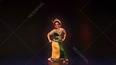 Confident Front View of Traditional Javanese Dancer on Theater Stage