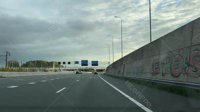 Amsterdam Netherlands highway, Urban motorway traffic under cloudy skies with