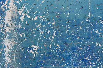 Peeling blue paint on wall texture