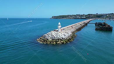 Brixham, Torbay, South Devon, England: DRONE VIEWS: Brixham Harbour lighthouse, the Outer Harbour Wall and various boats