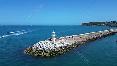 Brixham, Torbay, South Devon, England: DRONE VIEWS: Brixham Harbour lighthouse, the Outer Harbour Wall and various boats