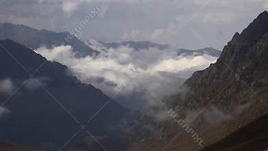 Patagonia Argentina mountain valley catches clouds between sharp ridges and dawn light, mountains, andes, south america, andean