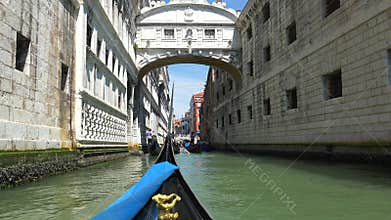 Gondola glides through Venice canal with romantic travel mood classic water transport detail, boat, along, carries, venetian