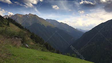 Patagonia Argentina rustic cabin stands beside meadow clearing and forest valley, andes, south america, andean, wooden shelter