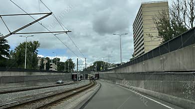 Amsterdam Zuid business district roadway with tram tracks, high-rise apartment