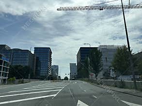 Quiet Amsterdam Zuid street with modern office towers, road markings
