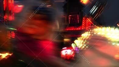 Fairground at night in city