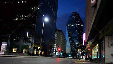 Street corner with view on Skyscraper in Downtown Dallas at night