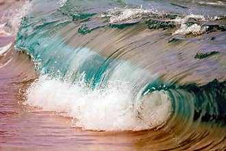 Wave breaking on shoreline.