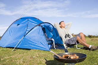 Man relaxing on camping trip