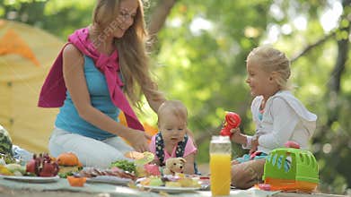 Beautiful mother with two charming little girls