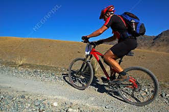 Mountain biker racing in desert
