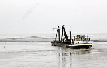 Dredger in Dollard near Nieuw Statenzijl, Netherlands