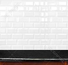 Empty black marble table and ceramic tile brick wall in background. product display template.