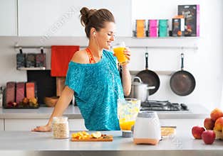 Fitness woman drinking pumpkin smoothie