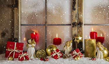 Classical christmas wooden window decoration with red candles an