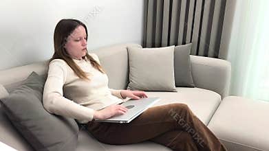 Laptop session ends as woman closes device and removes glasses