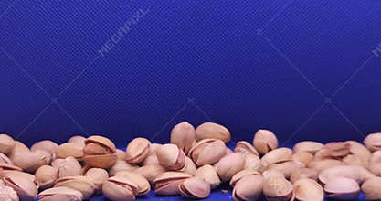 Roasted Salted Pistachios Falling Close Up
