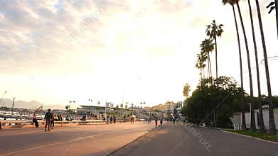 Sunlit Cannes promenade by Palais des Festivals and Carlton Hotel