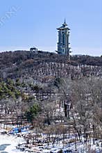 Early Spring Snow - View of the Tower at Jingyuetan National Forest Park, Changchun, China
