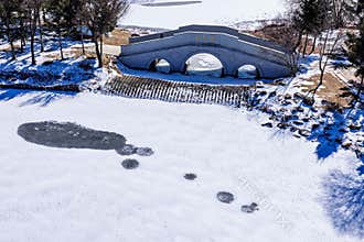 Early Spring Snow - Yulun Bridge Scenery in Jingyuetan National Forest Park, Changchun, China