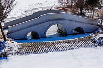 Early Spring Snow - Yulun Bridge Scenery in Jingyuetan National Forest Park, Changchun, China