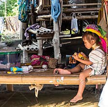 Long neck tribe little girl playing
