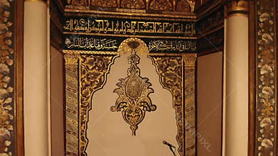 Ornate mihrab and Islamic decoration glow inside Bursa Ulu Cami at night in Turkiye, mosque, interior, masjid, minbar