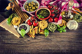Italian and Mediterranean food ingredients on old wooden background.
