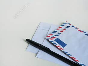 Mix of plain and airmail envelopes with pen, postal correspondence set