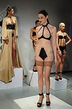 NEW YORK, NY - OCTOBER 25: Models pose during Love Cage Spring 2015 lingerie presentation