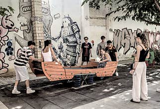 People going about their daily lives in the streets of the city of Valencia