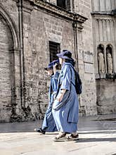 People going about their daily lives in the streets of the city of Valencia