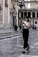 People going about their daily lives in the streets of the city of Valencia
